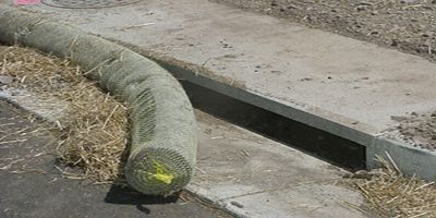 curb inlet protected with a polypropylene grate guard